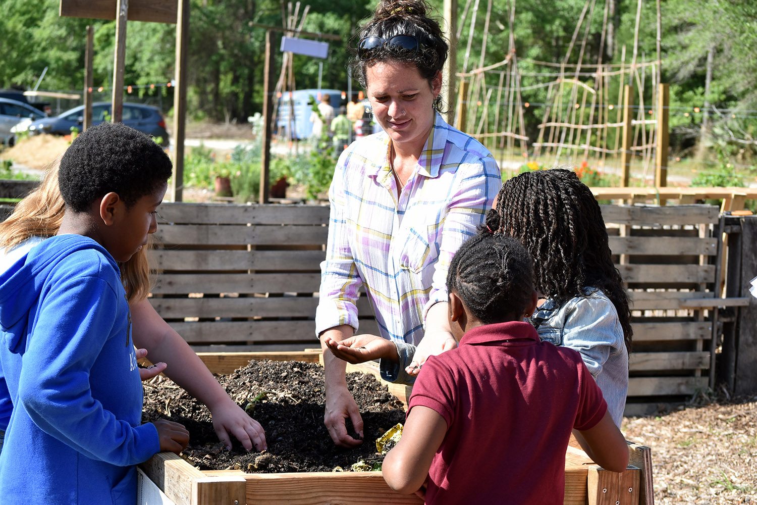 Students learn about how worms help gardens.